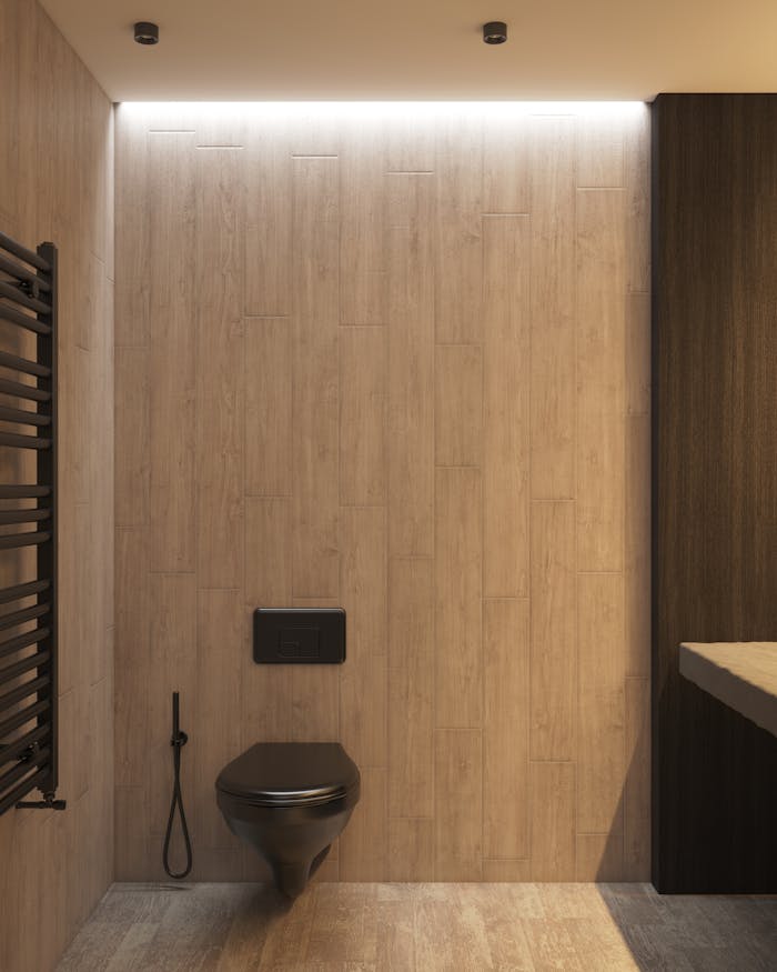 Spacious minimalist bathroom featuring a sleek black toilet and wooden walls. Ideal for interior design inspiration.